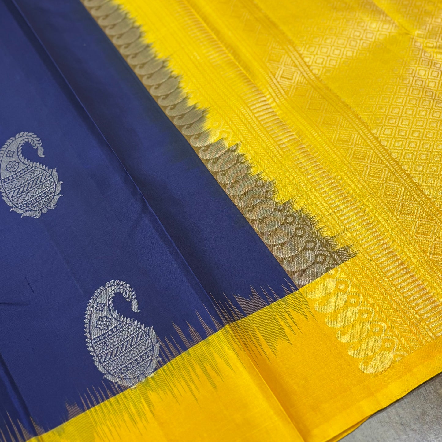 Regal Dark Blue and Yellow Kanchipuram Silk Saree with Silver Zari Work